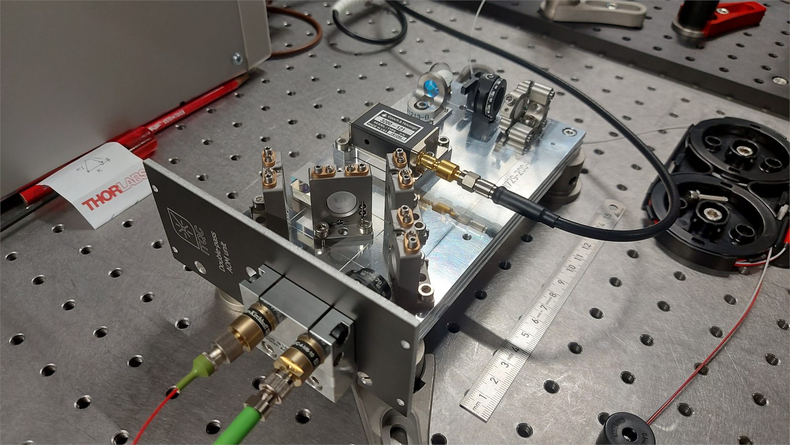 Prototype acousto-optic modulation board on an optical table