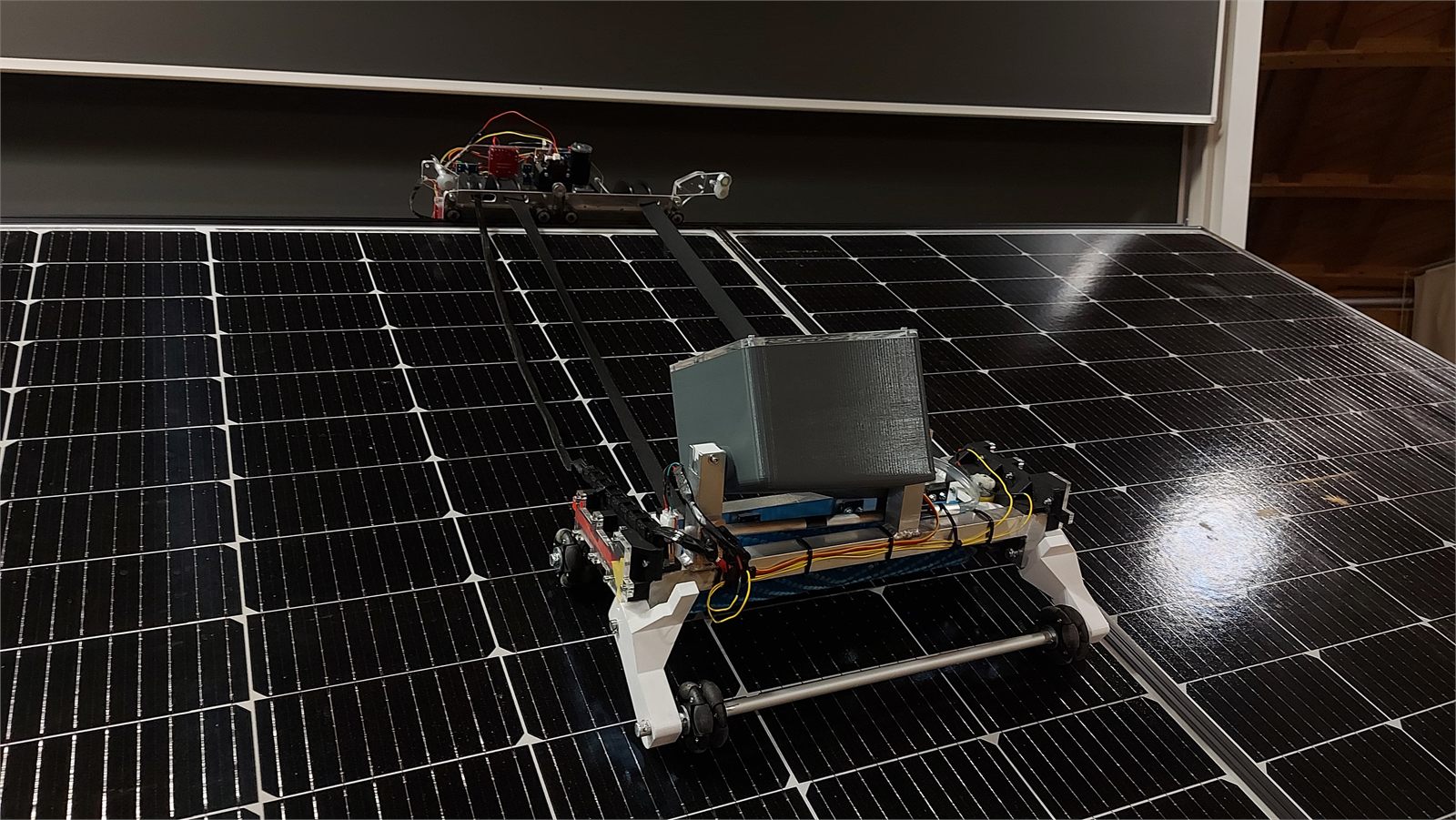 Autonomous solar panel cleaner prototype on a panel array